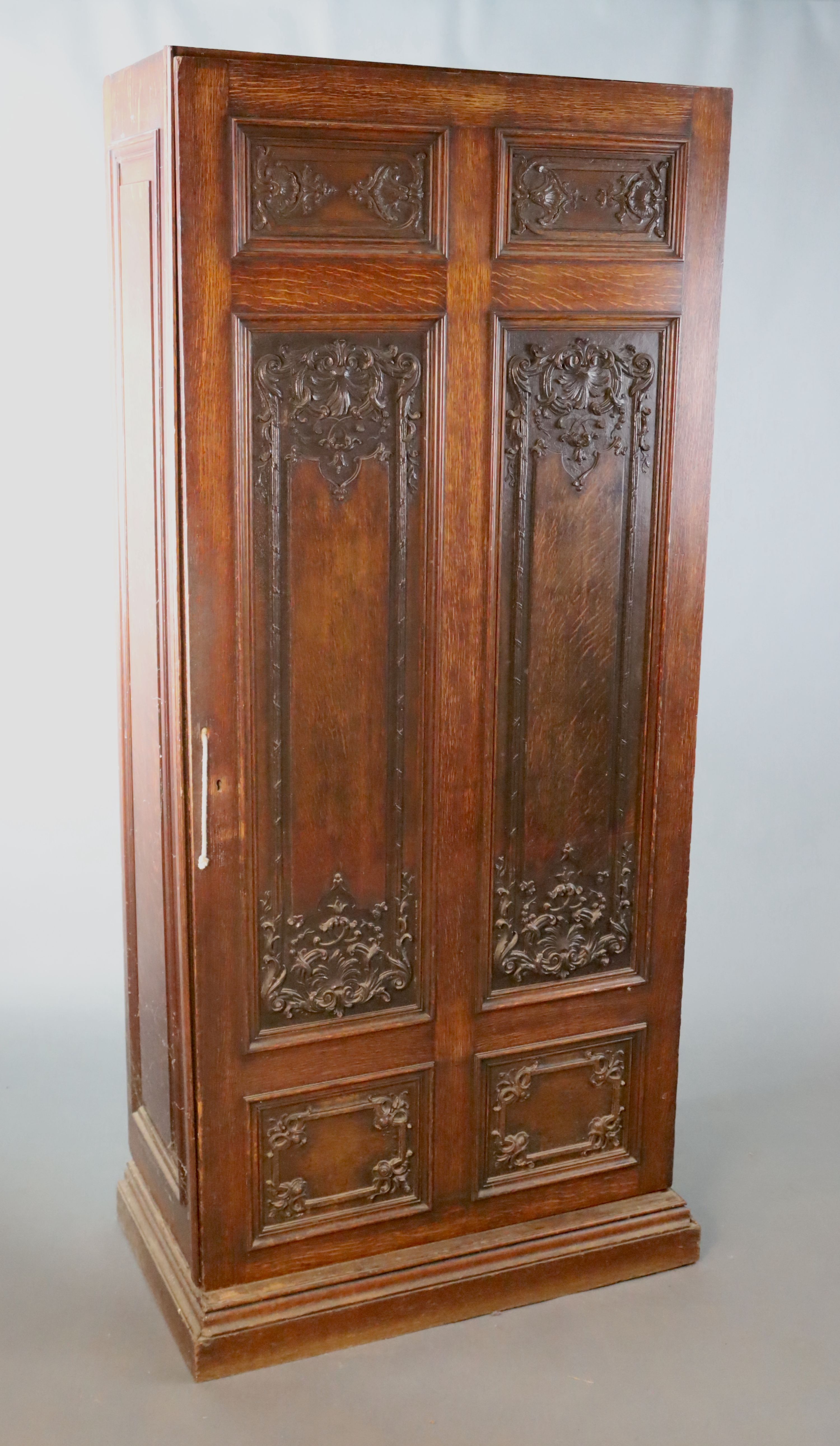 A late 19th century French oak hall cupboard, W.119.5cm D.51cm H.200.5cm